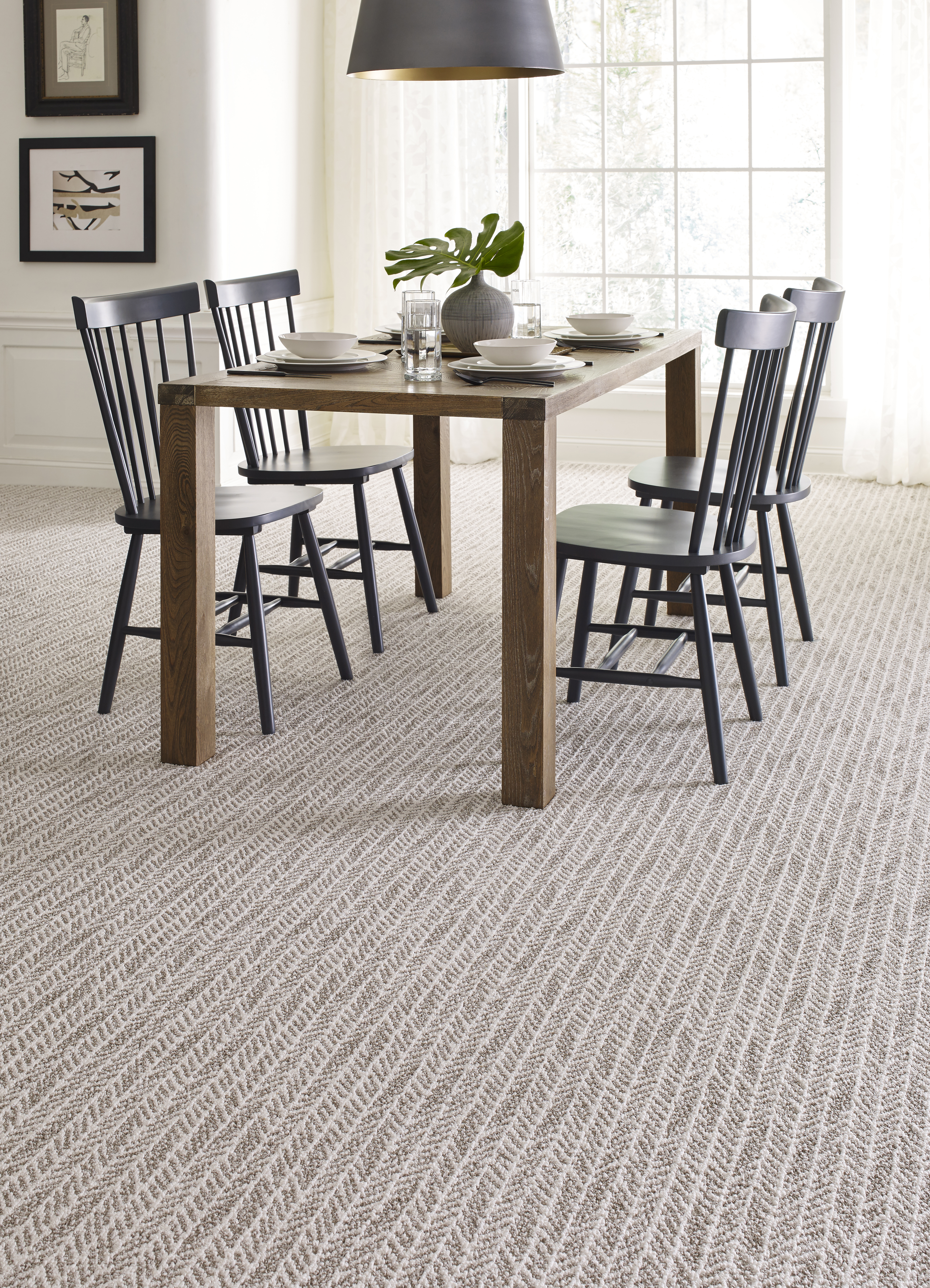 loop carpet with pattern in dining room setting featuring table, chairs